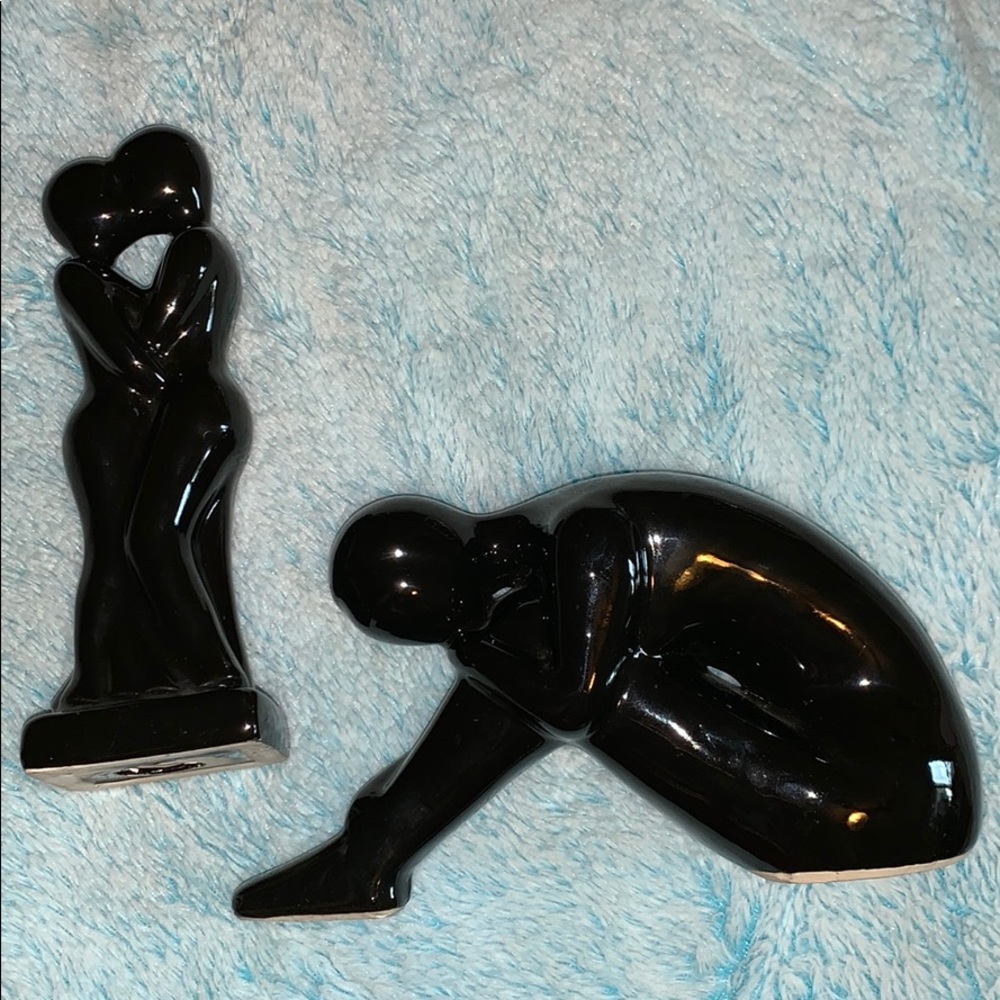 two little black figurines